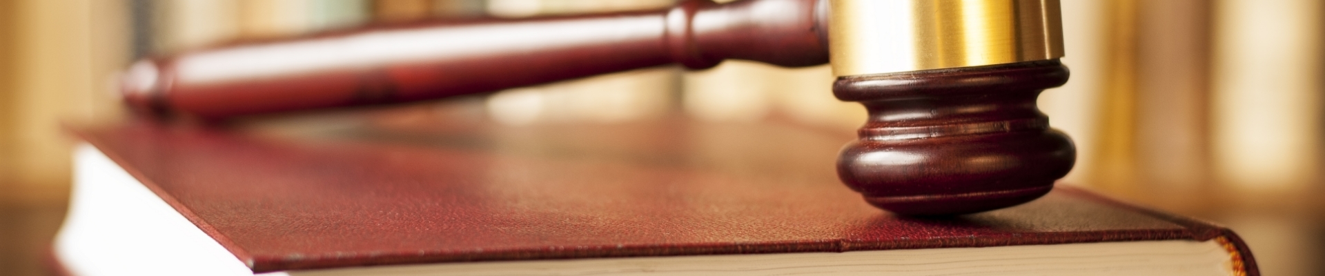 cropped-view-of-judge-in-judicial-robe-sitting-at-1